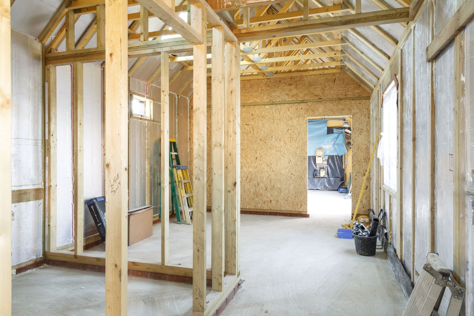 The timber framing of a home addition under construction